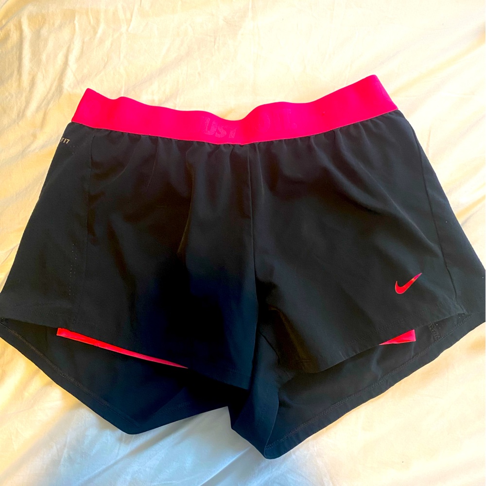 Nike athletic shorts with built in pink compression shorts size medium.